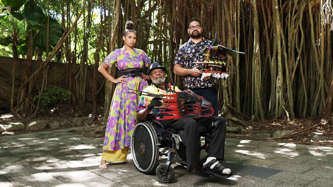 The Cairns Indigenous Art Fair will return to the Tanks Arts Centre this year, where the event was officially launched on Friday. Gillyba Ambrum models a bespoke dress by designer Lynelle Flinders, while Erub Island artist Dr Ken Thaiday Senior shows CIAF artistic director Theo Ropeyarn has world renowned Torres Strait Island headdresses. Picture: Brendan Radke