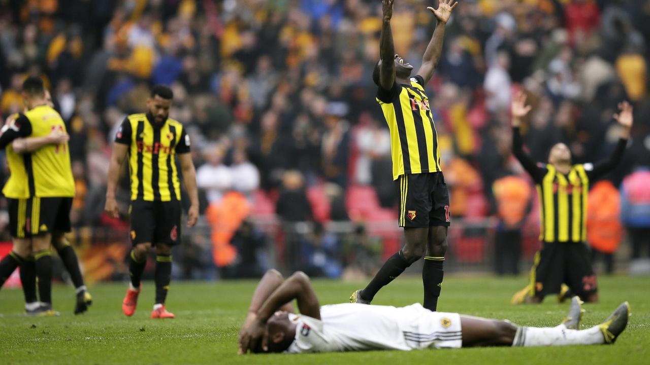 Watford's Ken Sema, center, celebrates at the end of the English FA Cup semifinal