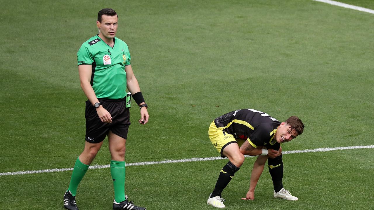 Referee Benjamin Abraham made a hugely controversial handball call against Phoenix’s Louis Fenton (R)