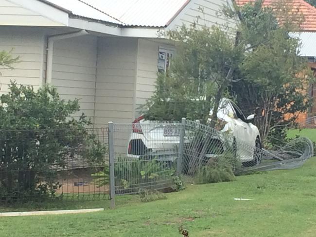 Motorist hurt after crashing in to fence, house in Harristown