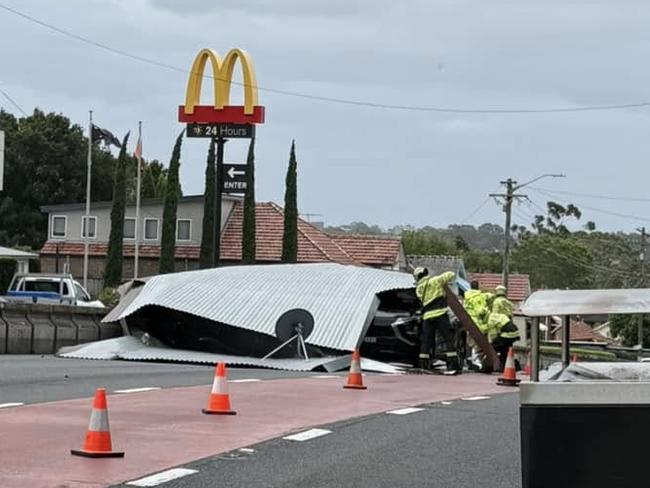 Emergency works at the scene in Drummoyne where a shop roof was blown off onto cars on a road. Picture: Facebook