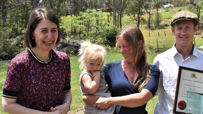 Georgia and her partner, Tommy Welham, with their daughter, Maisy, share a laugh with NSW Premier Gladys Berejiklian during her visit to the Nymboida Community Hall on Monday, October 26. Picture: Bill North