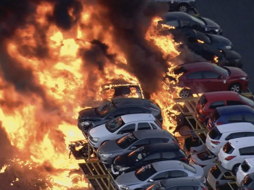 A massive blaze has erupted in a car yard in Perth, resulting in the destruction of dozens of cars. Picture: Nine News/Channel 9