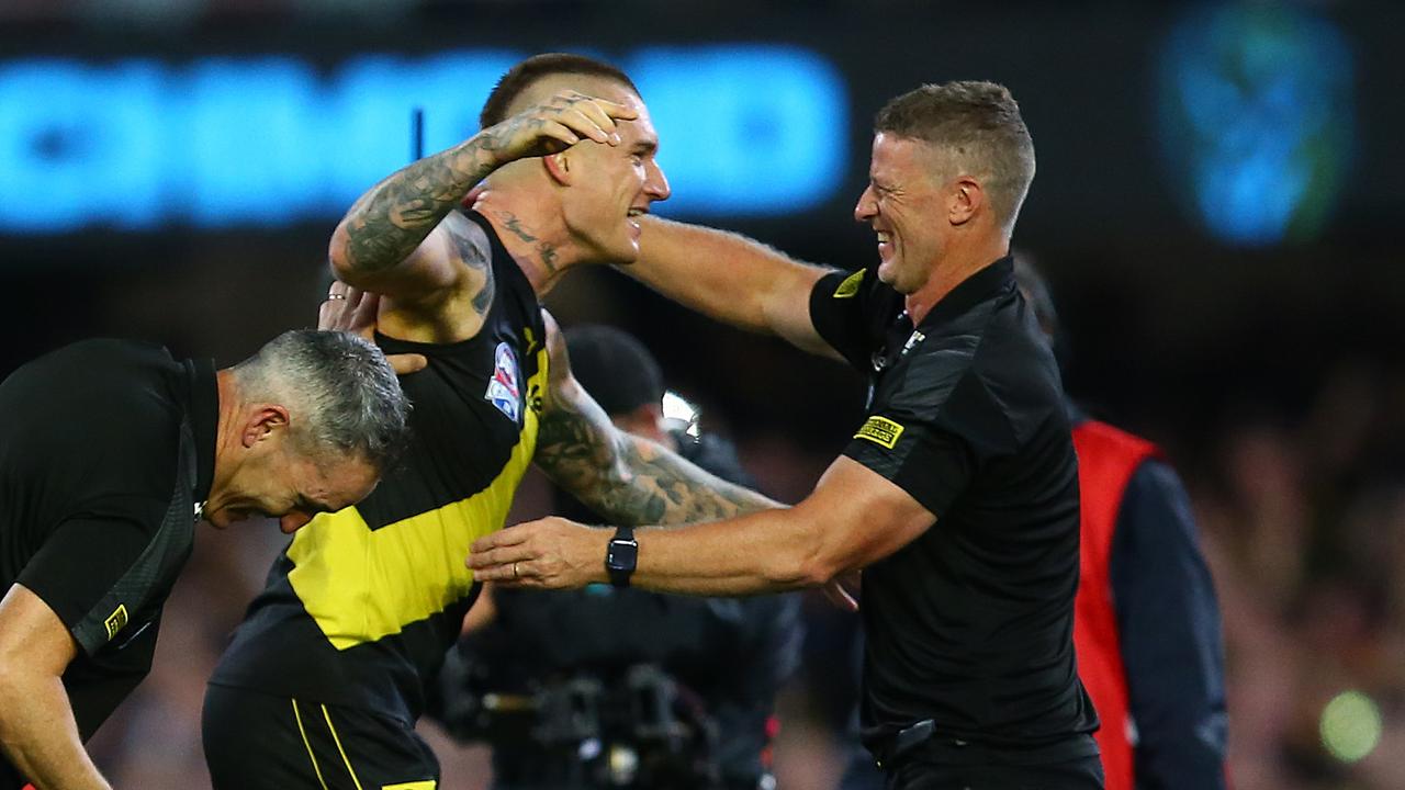 BRISBANE, AUSTRALIA - OCTOBER 24: Dustin Martin of the Tigers celebrates with coach Damien Hardwick after winning the 2020 AFL Grand Final match between the Richmond Tigers and the Geelong Cats at The Gabba on October 24, 2020 in Brisbane, Australia. (Photo by Jono Searle/AFL Photos/via Getty Images)