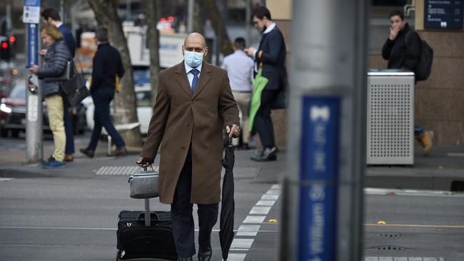 People head to work in the Melbourne CBD during the morning peak. Picture: NCA NewsWire / Andrew Henshaw