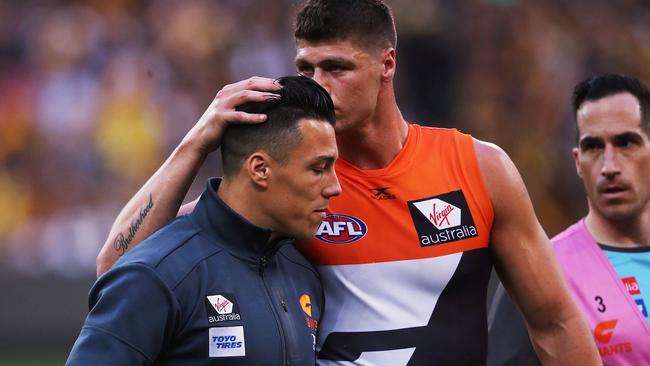 Jonathon Patton consoles Dylan Shiel after the preliminary final. Picture: Phil Hillyard