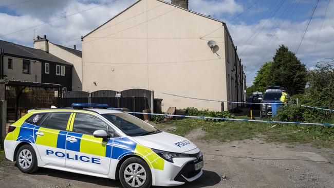 Police forensic officers search a house in Rochdale, England. Picture: Getty Images.