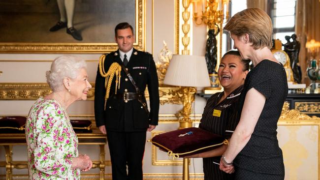 The Queen presents the George Cross to NHS England CEO Amanda Pritchard, right, and May Parsons, Modern Matron at University Hospital Coventry and Warwickshire. Picture: AFP