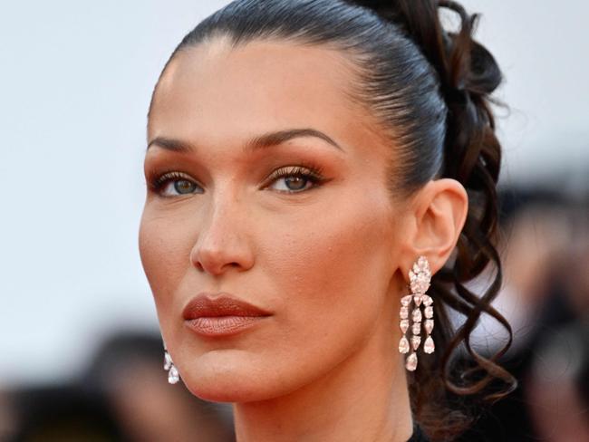 (FILES) US model Bella Hadid arrives for the screening of the film "L'Amour Ouf" (Beating Hearts) at the 77th edition of the Cannes Film Festival in Cannes, southern France, on May 23, 2024. Adidas said on July 19, 2024, it had dropped vocal pro-Palestinian model Bella Hadid from an advertising campaign for retro sneakers referencing the 1972 Munich Olympics, which were overshadowed by a massacre of Israeli athletes. (Photo by Christophe SIMON / AFP)
