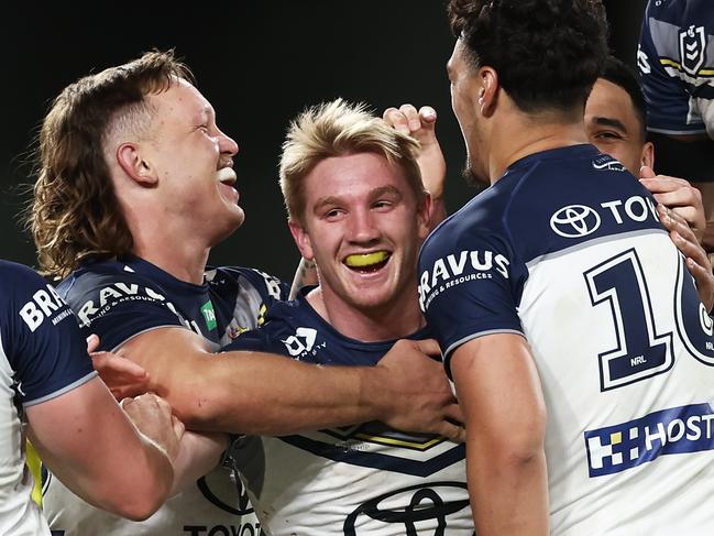 SYDNEY, AUSTRALIA - JUNE 25:  Tom Dearden of the Cowboys celebrates with team mates after scoring a try during the round 17 NRL match between South Sydney Rabbitohs and North Queensland Cowboys at Accor Stadium on June 25, 2023 in Sydney, Australia. (Photo by Matt King/Getty Images)