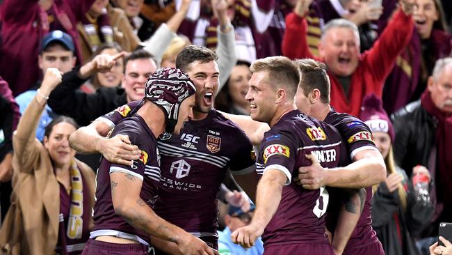 Kalyn Ponga, Corey Oates, Cameron Munster and Michael Morgan celebrate an Origin try in front of a frenzied Suncorp Stadium crowd. Picture: Bradley Kanaris/Getty Images