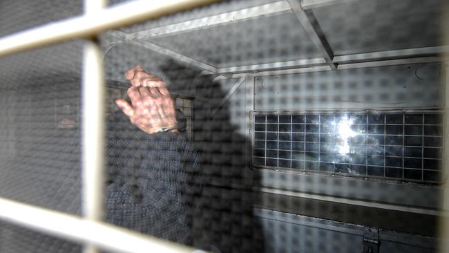 Robert John Fardon arrives at Townsville watchhouse after being arrested in 2007. Picture: Laird Cameron