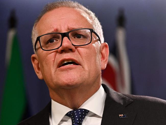 Australia's former prime minister Scott Morrison speaks to media during a press conference in Sydney on August 17, 2022. - Australia's Prime Minister Anthony Albanese on August 16 said that his predecessor Scott Morrison secretly seized control of five ministerial posts, labelling it an "unprecedented trashing of our democracy". (Photo by Steven Saphore / AFP)