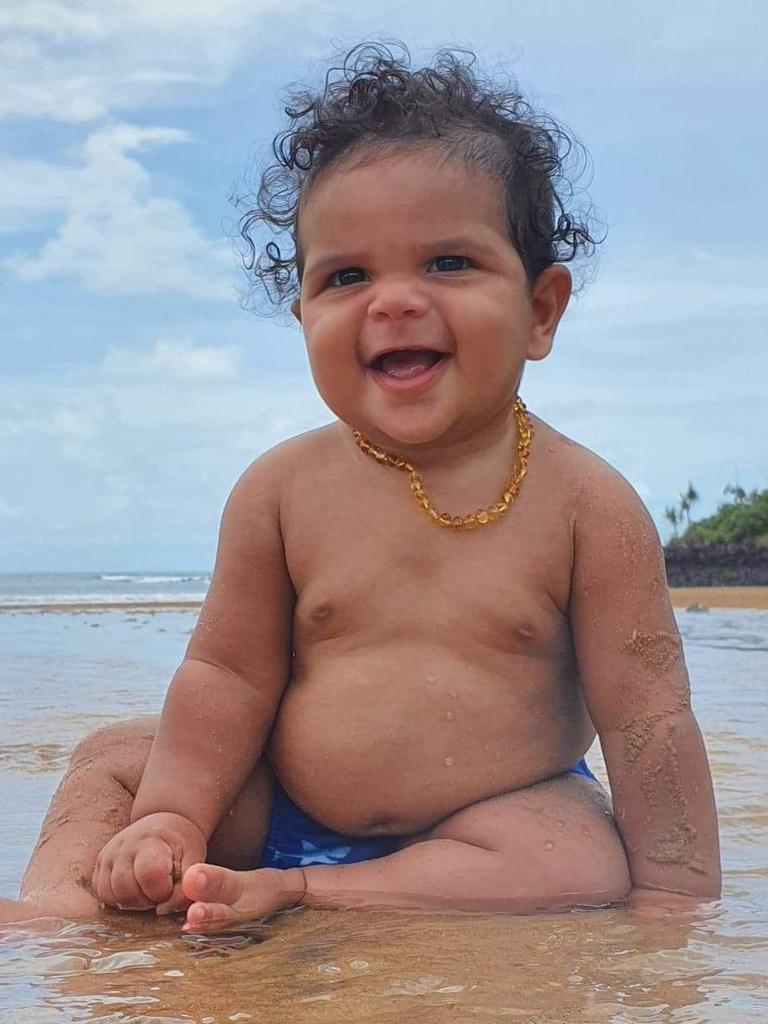 Six-months-old Donatello Wunungmurra, of Galiwinku, enjoying the beautiful scenic beaches of North East Arnhem Land. Picture: Megan Campbell