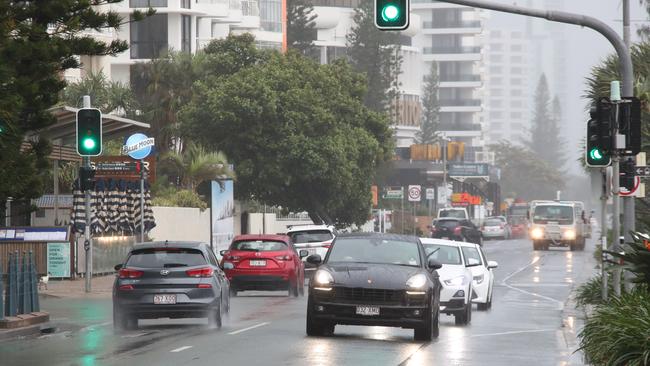 Surfers Paradise wakes up to its first day in lockdown due to the latest CoVid-19 scare. Tradesman still at work at Paradise Centre. Still traffic around.... Picture Glenn Hampson