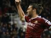 West Ham's Andy Carroll celebrates after scoring his team's second goal during the English Premier League soccer match between West Ham and Swansea at White Hart Lane stadium in London, Sunday, Dec. 7, 2014. (AP Photo/Kirsty Wigglesworth)