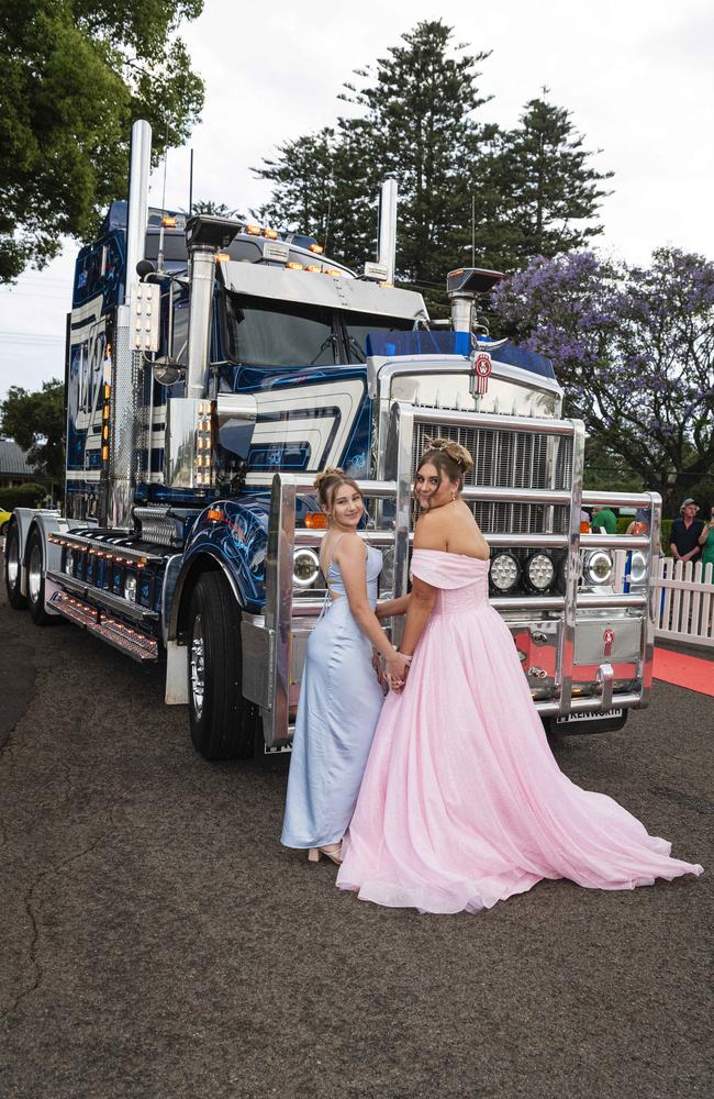 Graduate Tash James is partnered by her little sister Taylor at The Industry School formal at Clifford Park Racecourse, Tuesday, November 12, 2024. Picture: Kevin Farmer