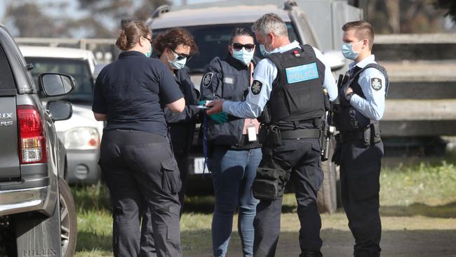 Police and federal police during a raid at a property on Bolinda-Darraweit Rd.