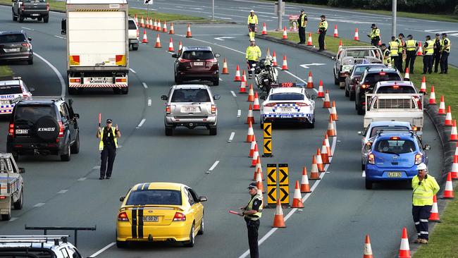 Police stop motorists on the Gold Coast Highway at Coolangatta on the Queensland-NSW border. Picture: AAP