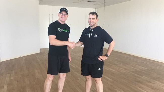 STAYING POSITIVE: Paul Timms with Got Active Fitness owner James Hargreaves.