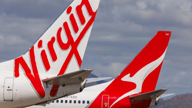 Townsville, Queensland - 28 July 2021: Virgin Australia and Qantas tails on display at Townsville Airport in far North Queensland27 October 2024Kendall HillPhoto - Getty Images