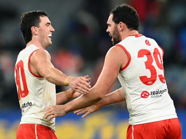 Tom and Paddy McCartin celebrate the Swans win on Saturday. Picture: Quinn Rooney