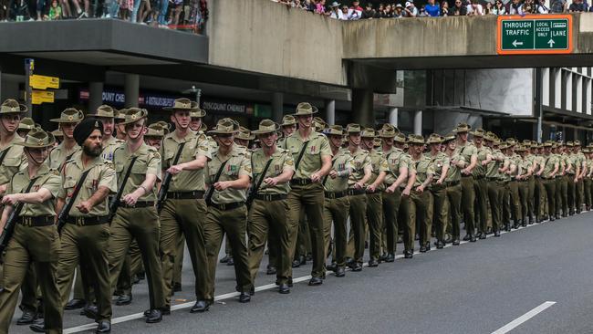 Thousands line Adelaide St in Brisbane for the 2023 Anzac Day march. Picture: NCA NewsWire/Glenn Campbell