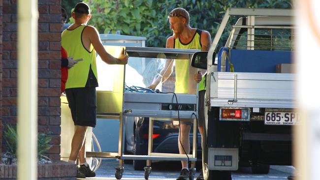 Contractors remove equipment as more ambulance staff arrive at the Earle Haven retirement complex on Thursday. Picture: Tertius Pickard