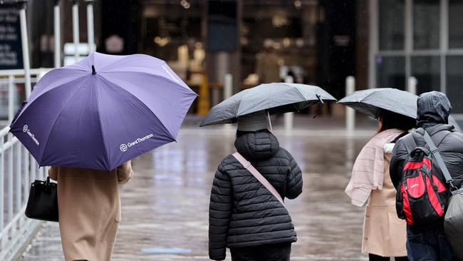 Sydneysiders have been warned to bring an umbrella with them on Friday before things get sunny on the weekend.. Picture: NCA NewsWire / Damian Shaw