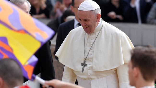 Pope Francis greets the crowd as he arrives for a weekly general audience at St Peter's square. Picture: AFP