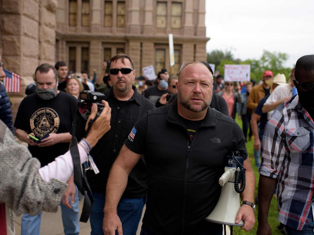 Alex Jones with protesters during the ‘Reopen America’ in Austin, Texas in 2020. Picture: Mark Felix/AFP