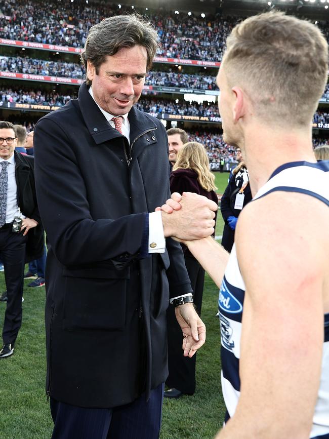 AFL boss Gillon McLachlan shakes Joel Selwood’s hand. Picture by Michael Klein