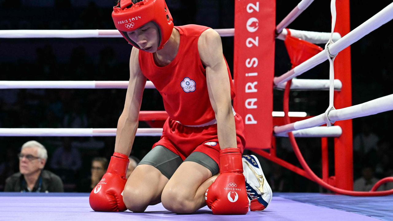 Taiwan's Lin Yu-ting gathers herself after being thrown to the ground. (Photo by MOHD RASFAN / AFP)