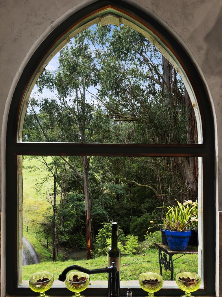 Arched windows and doors provide green views.