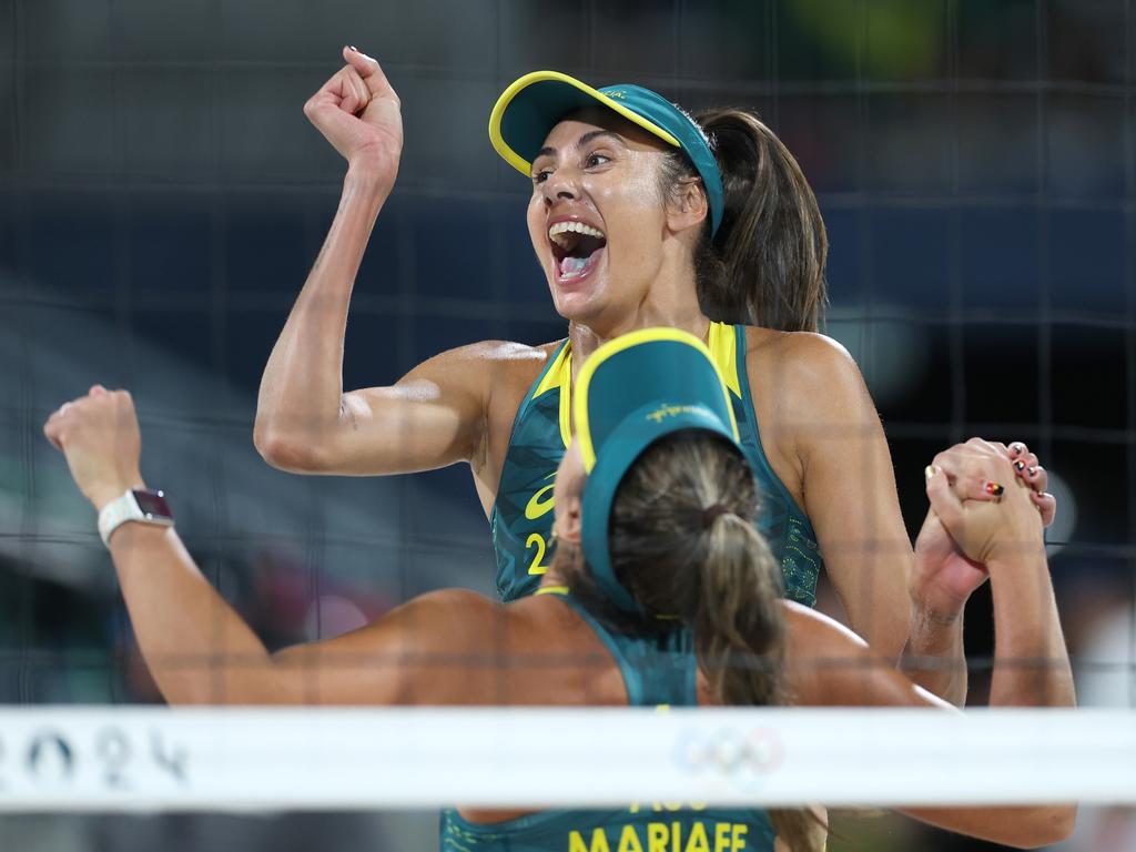 Mariafe Artacho del Solar and Taliqua Clancy, facing, of Team Australia celebrate after winning their women's quarterfinal match against Team Switzerland at Eiffel Tower Stadium on August 6 in Paris. Picture: Carl Recine/Getty Images