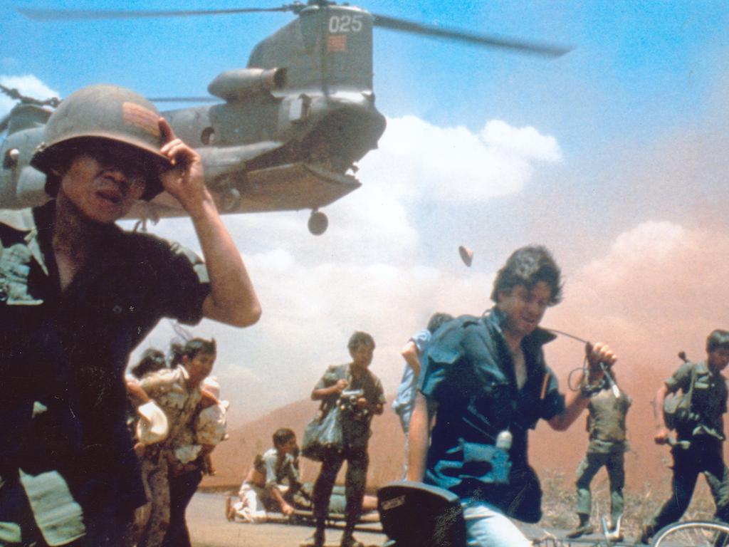 Iconic image of Aussie cameraman David Brill, trying to get evacuated four days before the fall of Saigon.