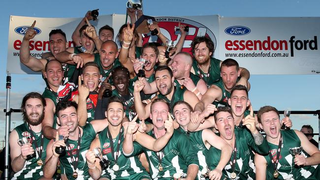 Airport West players celebrate the club’s Division 1 flag triumph. Picture: Mark Dadswell