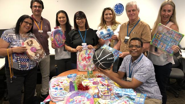 Staff at Woolloongabba-based Multicultural Australia getting the toys ready to give to refugee and asylum seeker children. Photo. supplied.