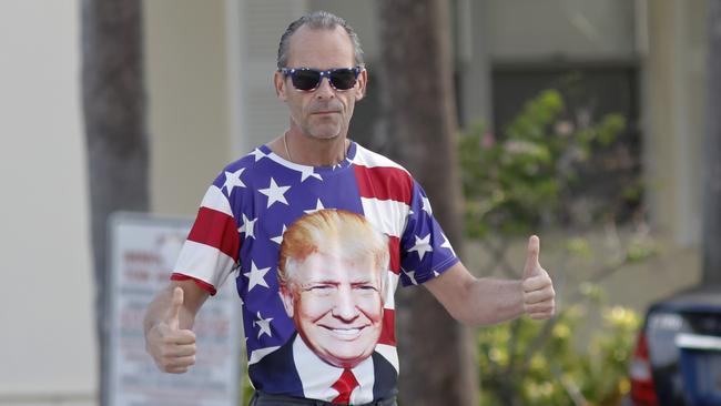 Donald Trump’s motorcade gets the thumbs up in West Palm Beach, Florida, yesterday. Picture: AP