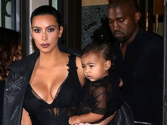 MUST CREDIT GETTY WEB RIGHTS ONLY PARIS, FRANCE - SEPTEMBER 28: Kim Kardashian, Kanye West and North West leave the 'Art District' apartments on September 28, 2014 in Paris, France. (Photo by Marc Piasecki/GC Images)