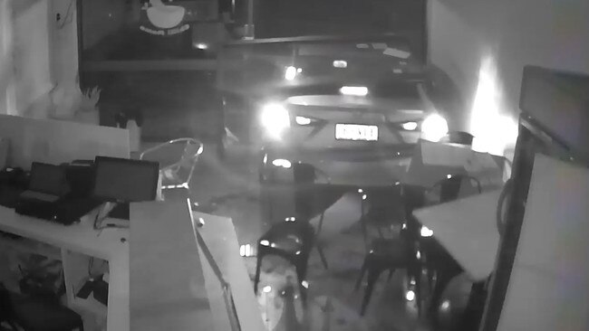 A stolen Mazda 3 reverses into the front of Chilli Mama Take Away in Whitfield in a separate, unrelated incident earlier this year. Picture: Supplied