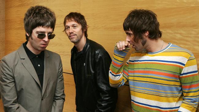 Noel Gallagher, left, Andy Bell and Liam Gallagher, right, members of Oasis, hold a photocall in Hong Kong in 2006. Picture: AFP