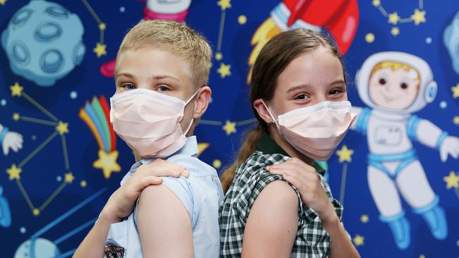 St Augustine's College student Hayden Allwood, 12, and St Francis Xavier School student Siena Allwood, 11, were vaccinated against the coronavirus at a CHHHS vaccination centre at The Pier Shopping Centre. Picture: Brendan Radke