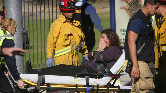 A victim is wheeled away ... on a stretcher following the shooting. Picture: David Bauman/The Press-Enterprise via AP