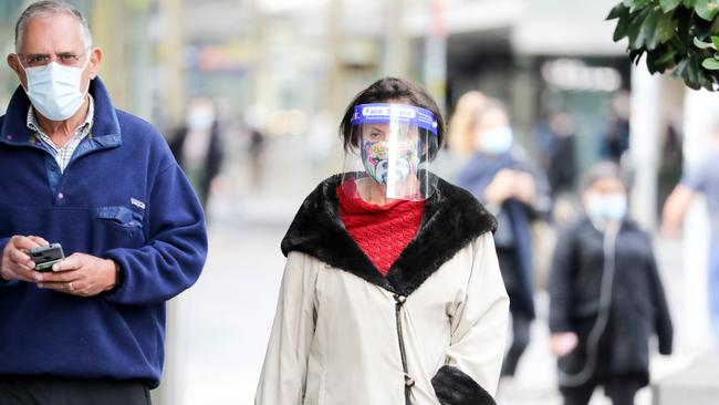 A woman wears a face shield in Sydney’s Bondi Junction. Picture: Ryan Osland