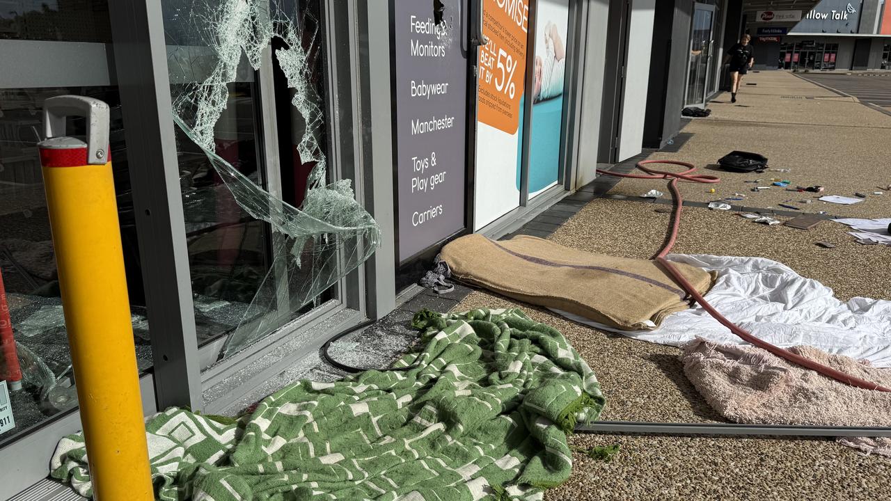 Seven shopfronts were found smashed up at Domain Central in Townsville on Friday morning. Picture: Natasha Emeck