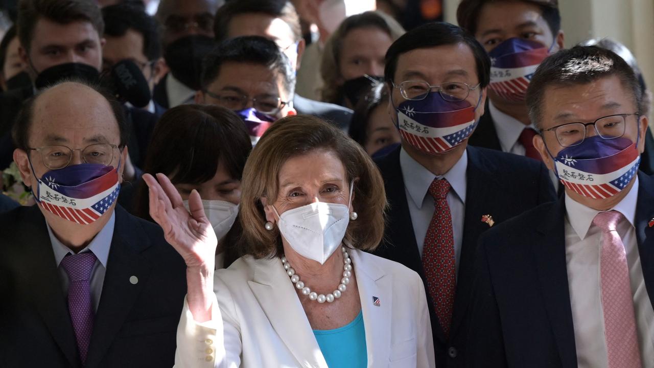 Visiting US House Speaker Nancy Pelosi waves to journalists during her arrival at the Parliament in Taipei on August 3, 2022. (Photo by Sam Yeh / AFP)