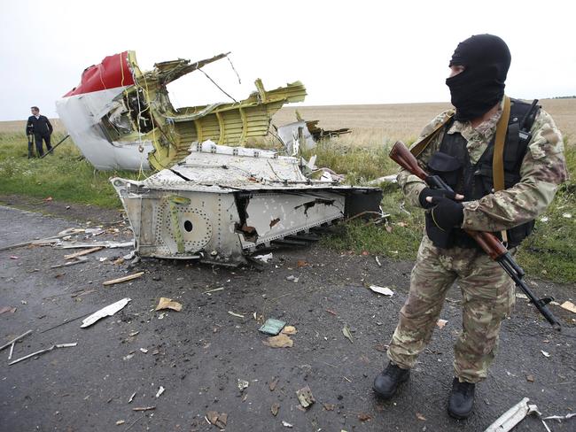 Crash site ... A pro-Russian separatist stands at the crash site of MH17, near the settlement of Grabovo in the Donetsk region. Picture: Reuters