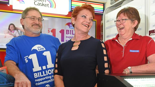 Pauline Hanson poses for a photo with newsagency owners John and Maree Allen at Wynnum North News while backing newsagents in fight against online betting giant Lottoland. Picture: AAP