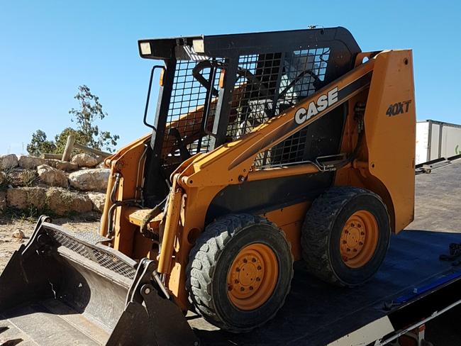 Police seized this allegedly stolen bobcat from the Ponde Hell Angels property during the search for evidence in two murder cases. Picture: SAPOL